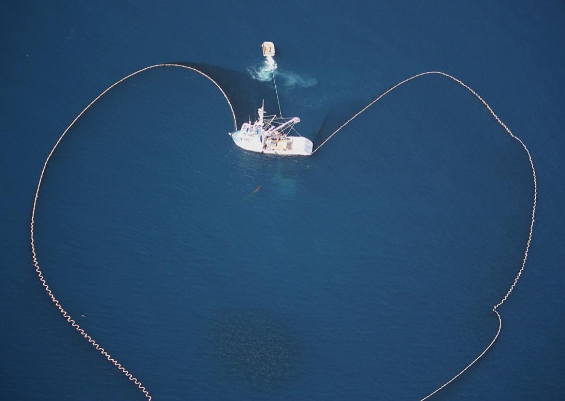 overhead photo of fishing boat with net