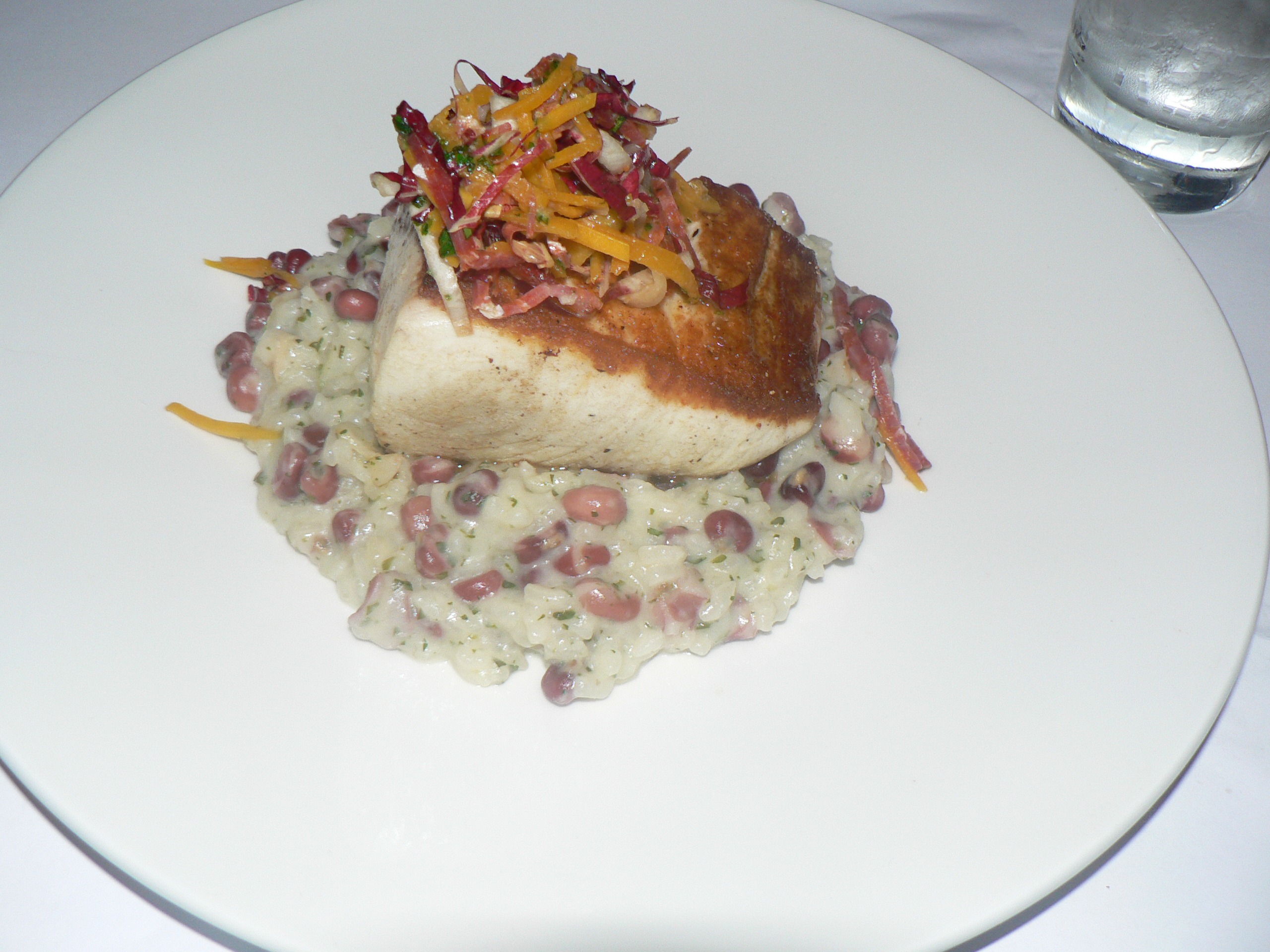 stu_spivack/flickr cooked wahoo on top of a bed of rice and beans with garnish
