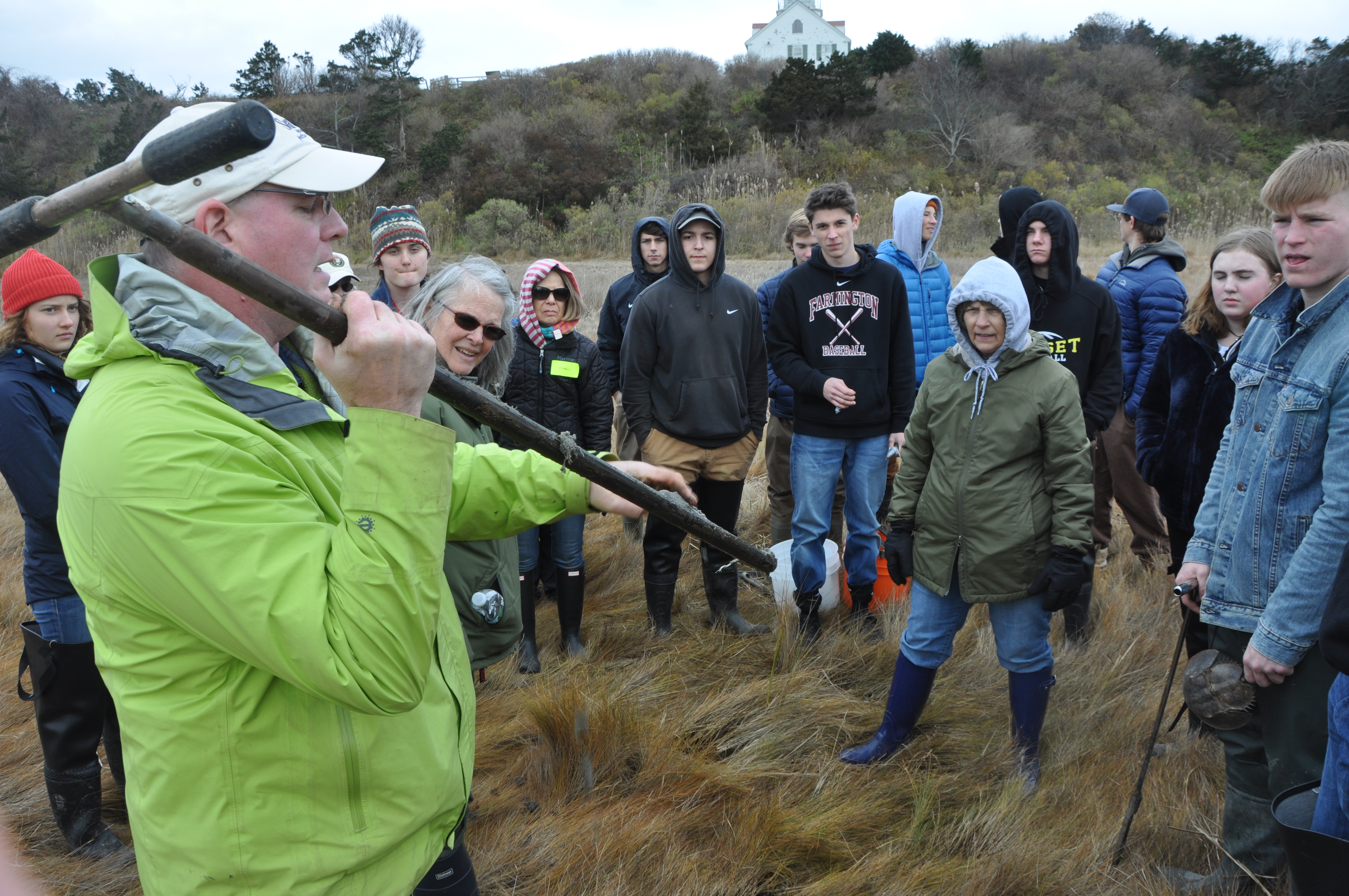 students being shown a soil corer