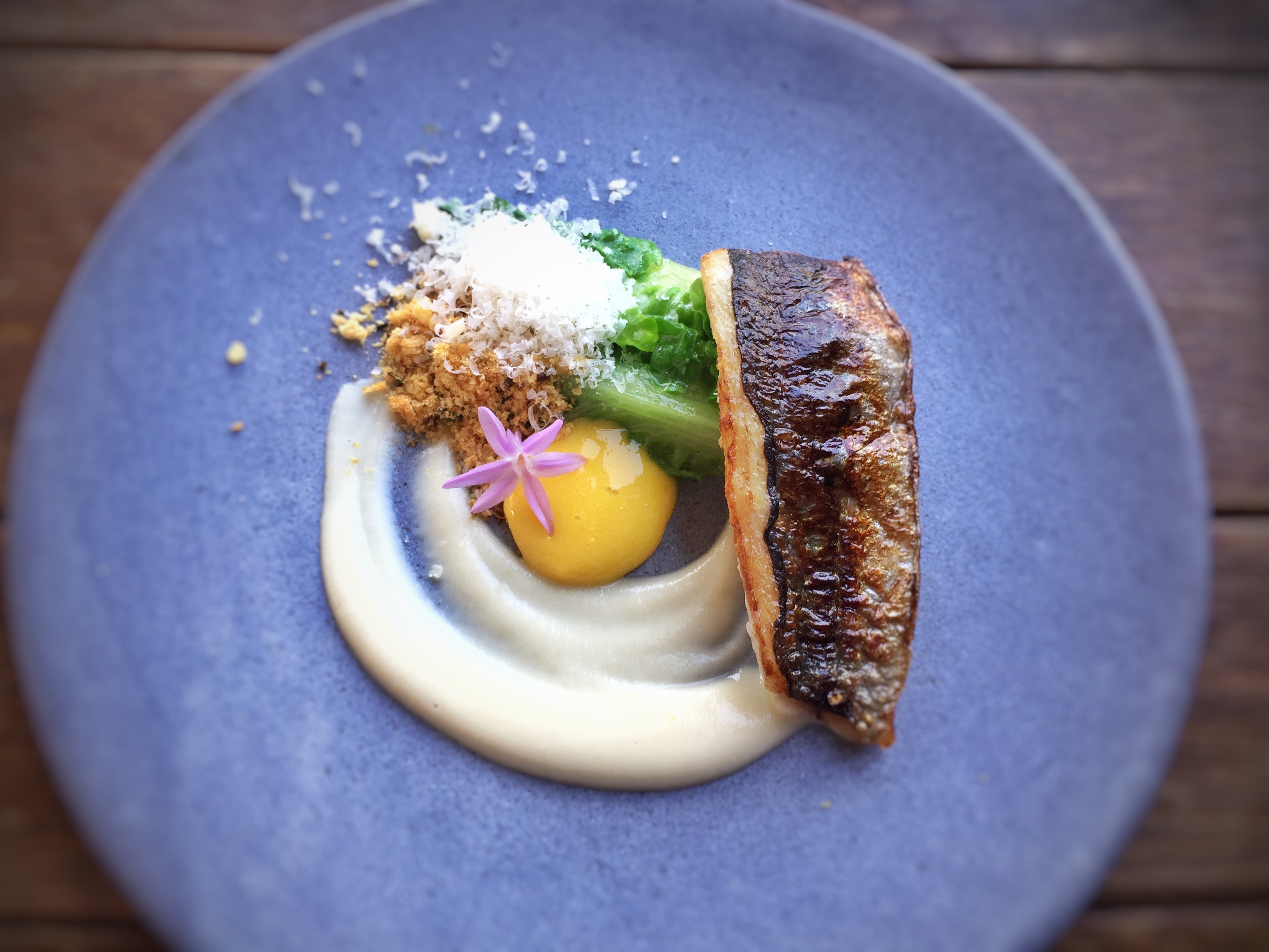 T.Tseng/flickr Jack mackerel fillet with egg yolk, creamy sauce, and romaine lettuce garnish
