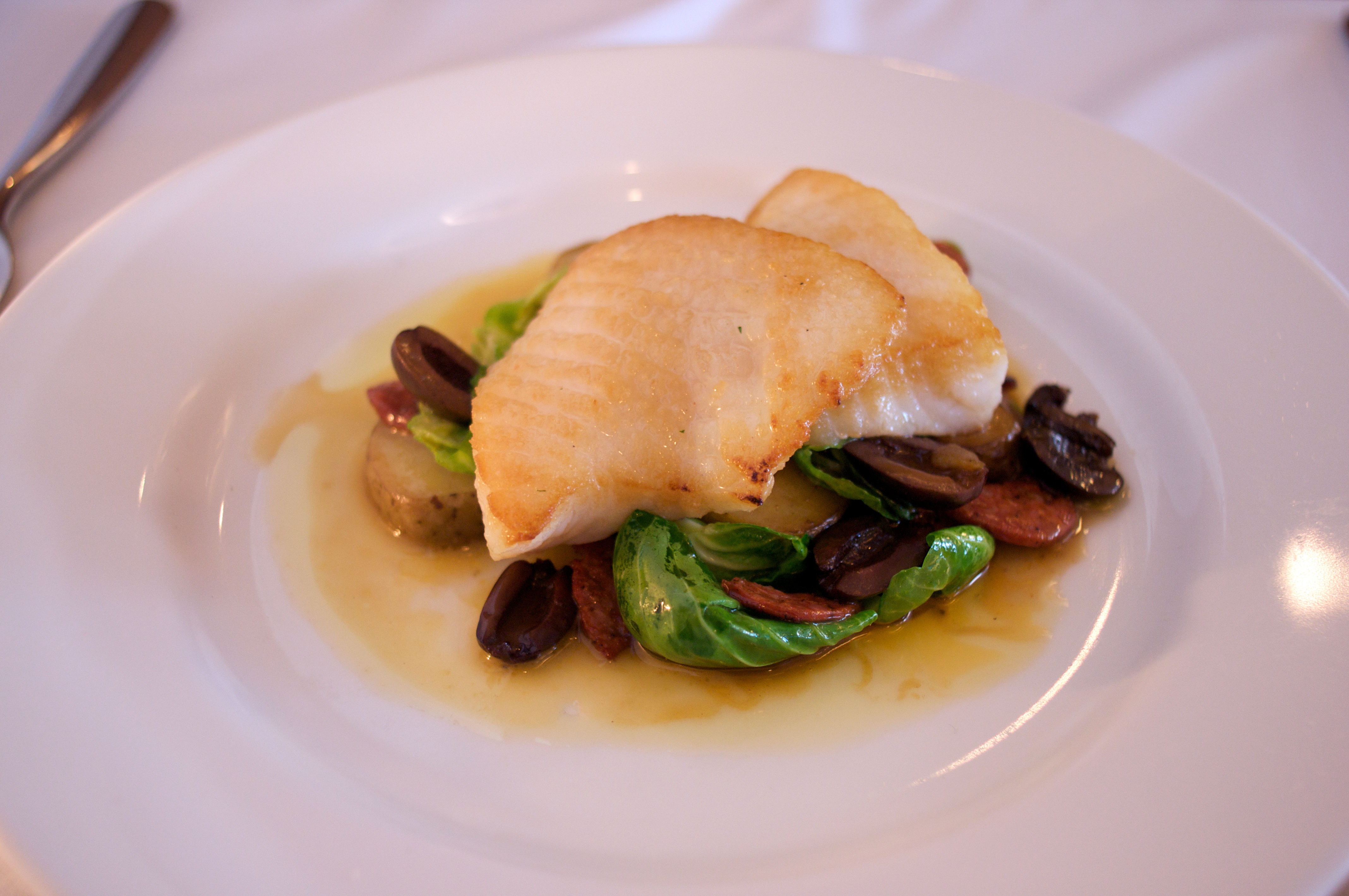 Rudy Eng/flickr pan-seared lingcod with brussel sprout leaves, sausage, olives, and potato