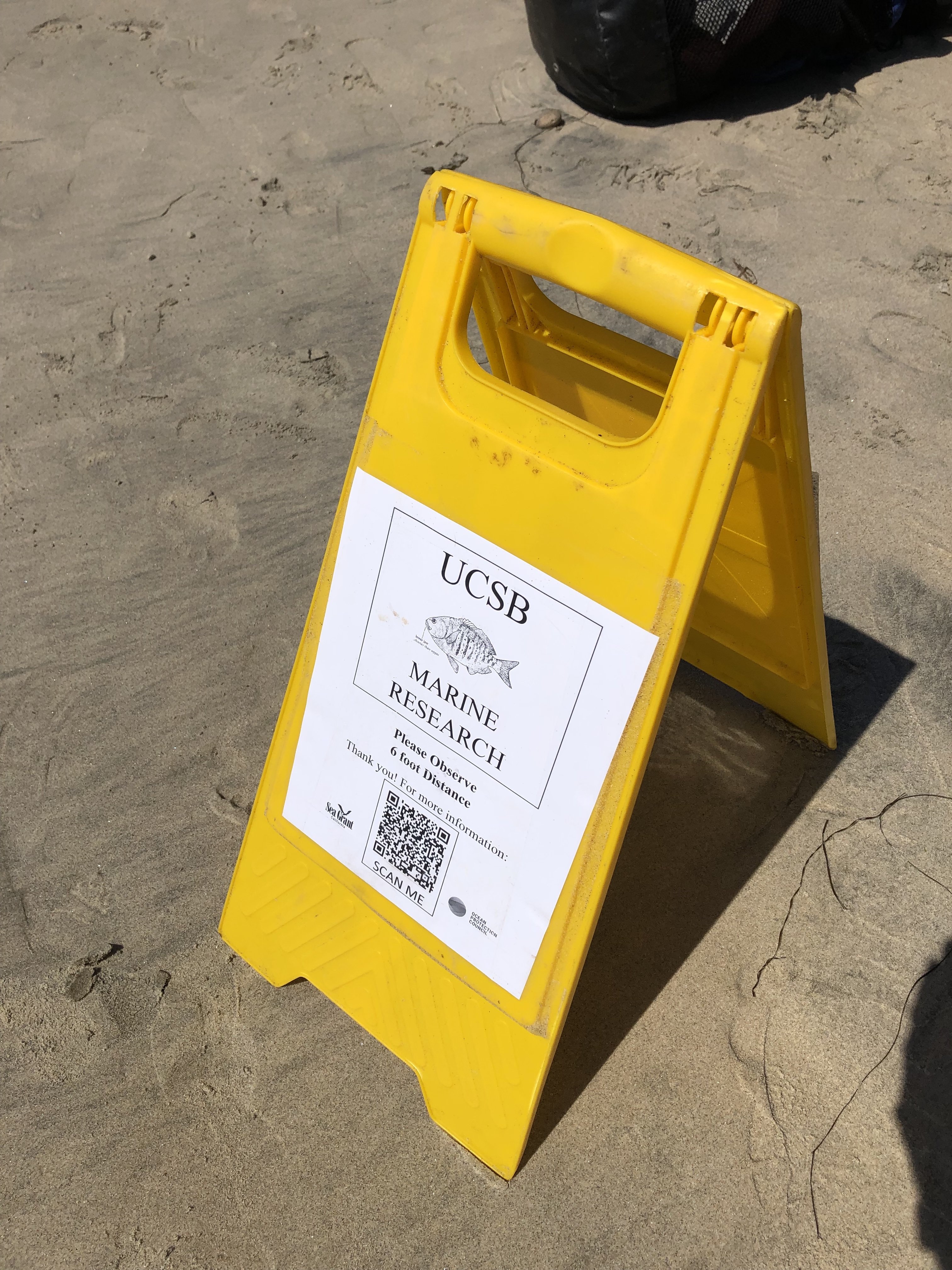 Sign notifying the public of the survey occuring at San Elijo State Beach.