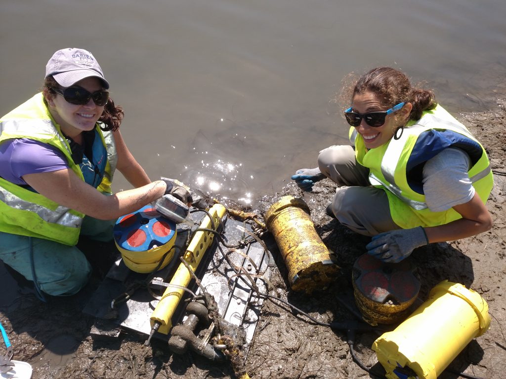 Researchers Madeleine Harvey and Isa Arzeno deploying research instruments at Los Peñasquitos Estuary in San Diego County.