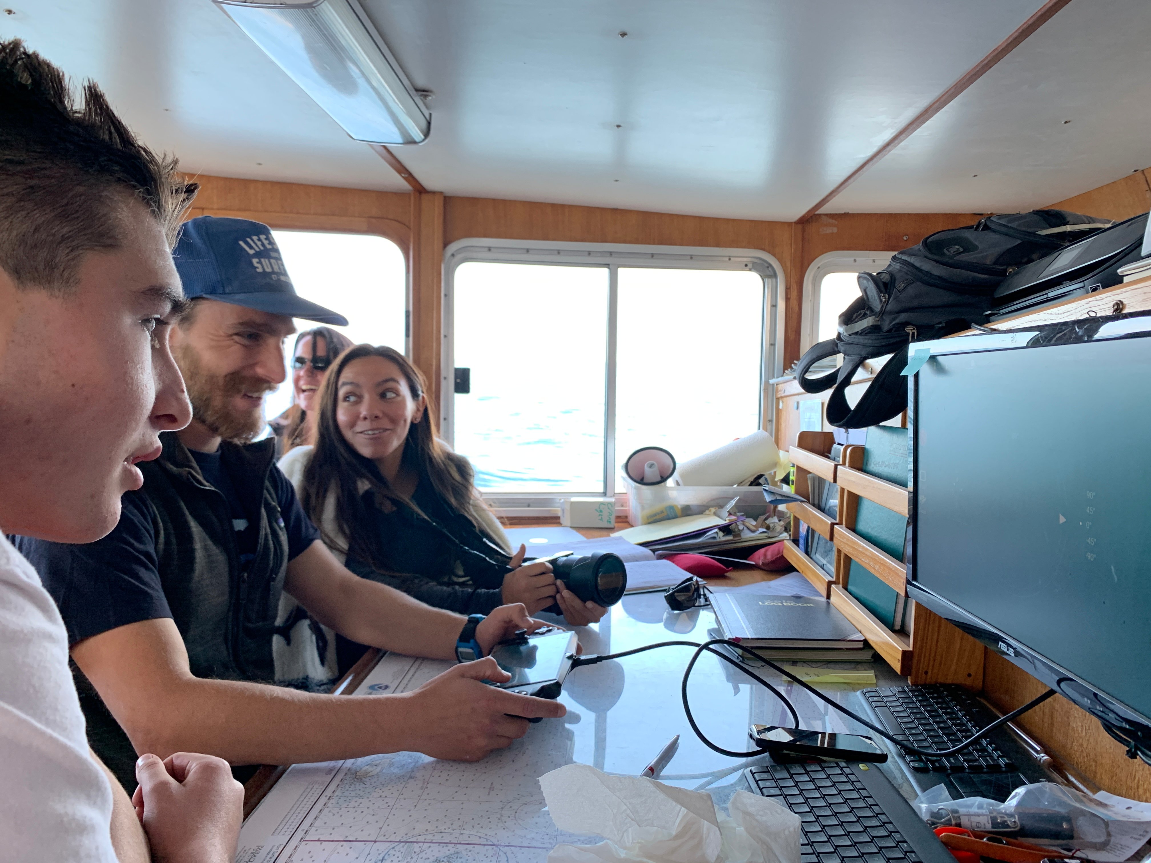 California Sea Grant state fellow Pike Spector demonstrates the nuances of piloting a Trident from the wheelhouse of r/v Shearwater. Students were able to see the pilot’s view of the ROV on a computer monitor mounted in the wheelhouse. Photo credit: Dr. Peavey-Reeves