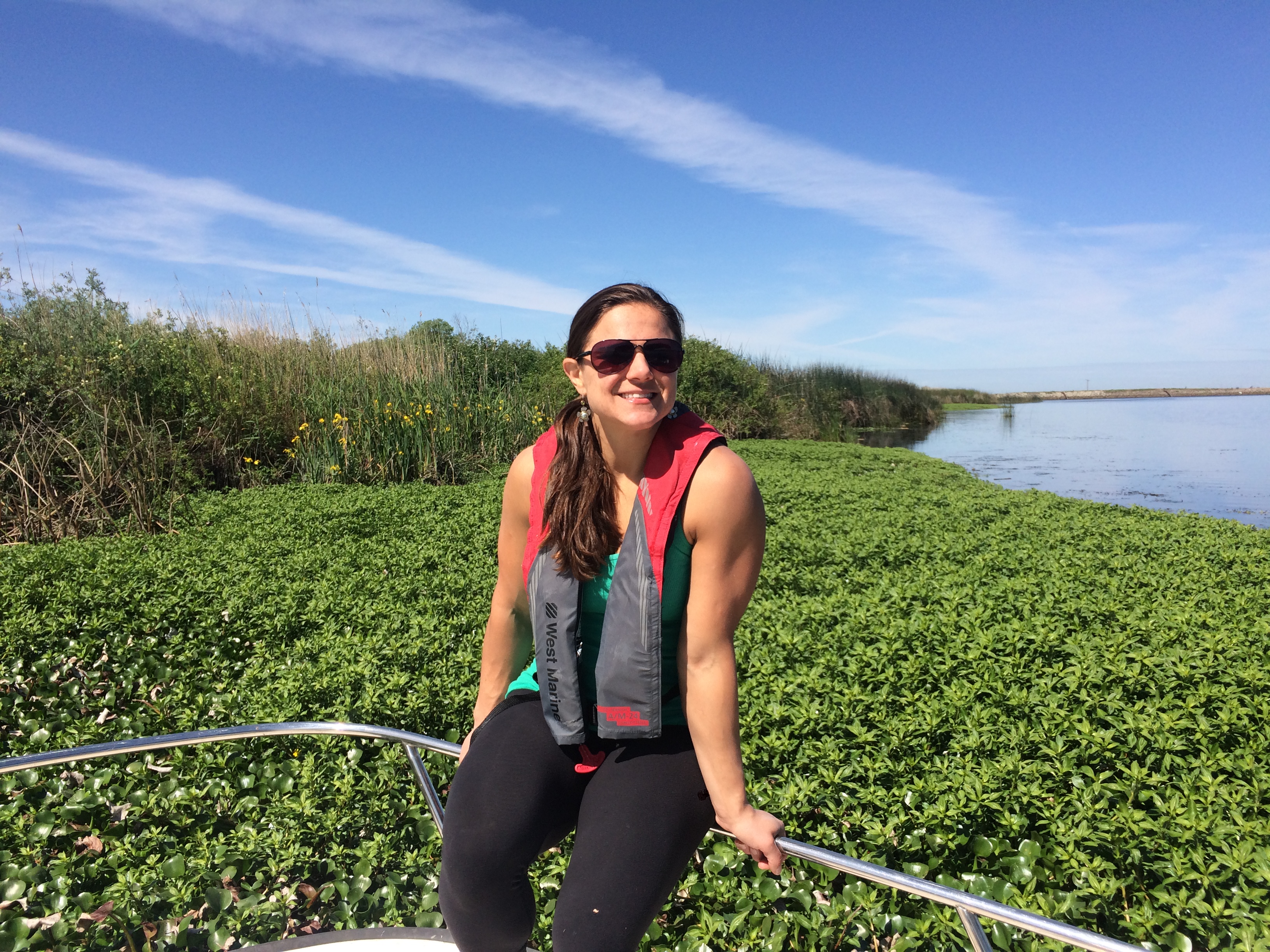 julie hopper in front of water hyacinth