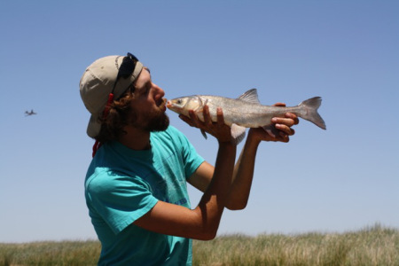 Matthew Young with a Sacramento blackfish, one of the native, resident fish species that he is studying. Credit: UC Davis