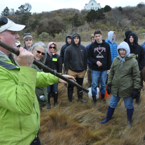 students being shown a soil corer