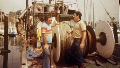 Craig Fusaro and Gordon Cota on a boat.
