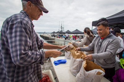A man buying rock crab at a market