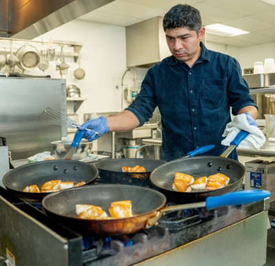 Chef Luis Cabanas prepares fish for a taste test at the Food Innovation Center in Portland