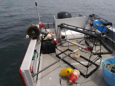 BRUV units on a 23 ft. boat with a trap hauler attached to the rail.