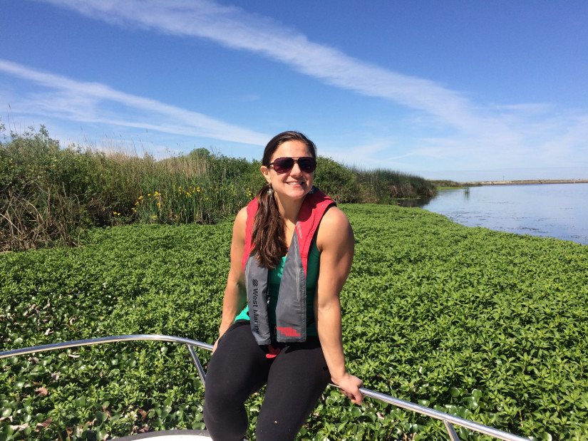 julie in the delta in from of overgrowth of water hyacinth