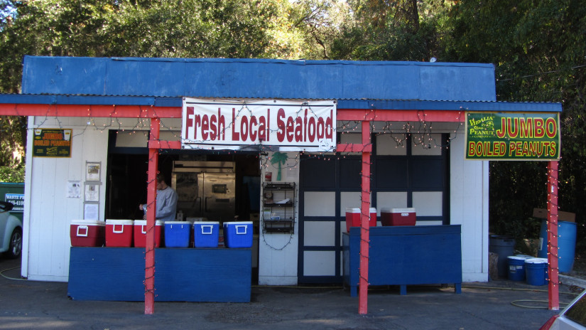 Red, white and blue roadside seafood stand.