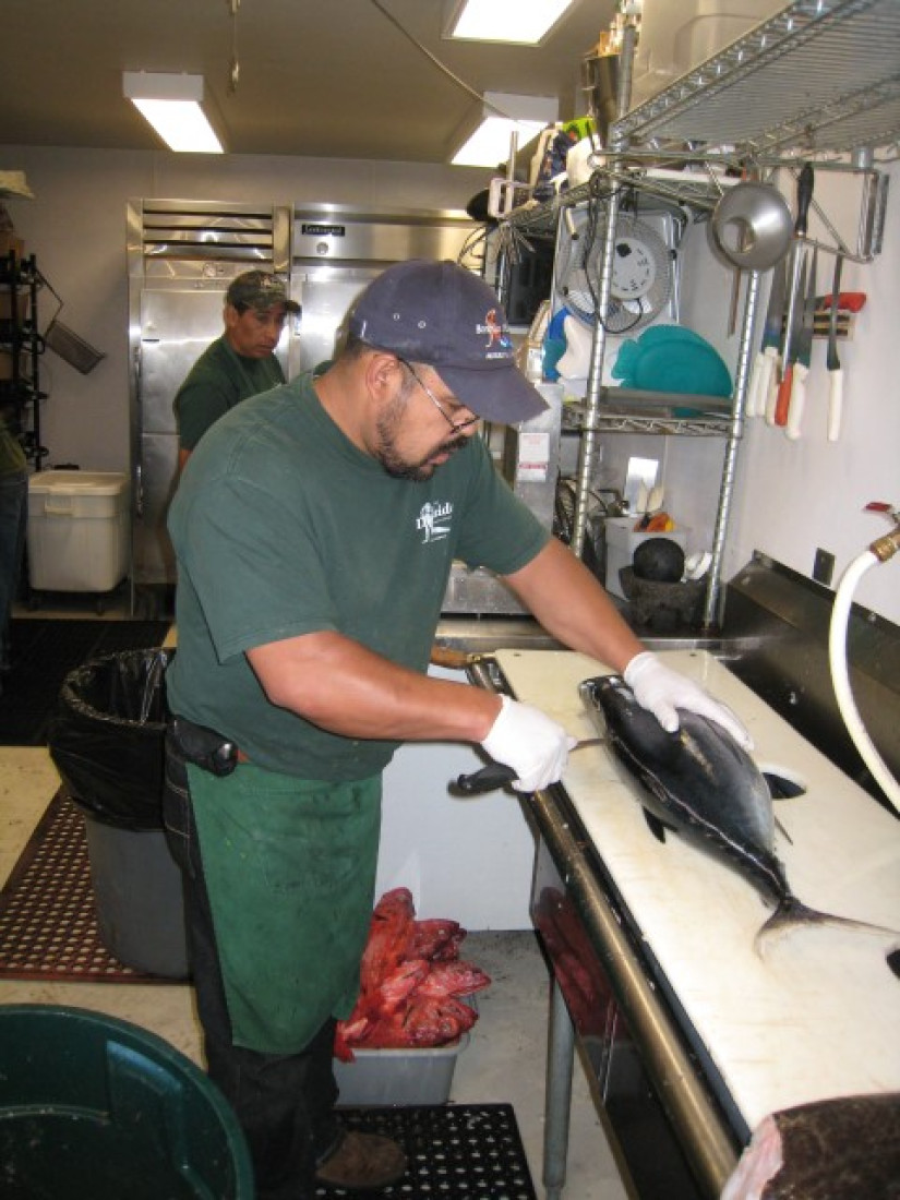 Man filleting fish