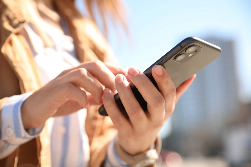 person looking something up on iphone