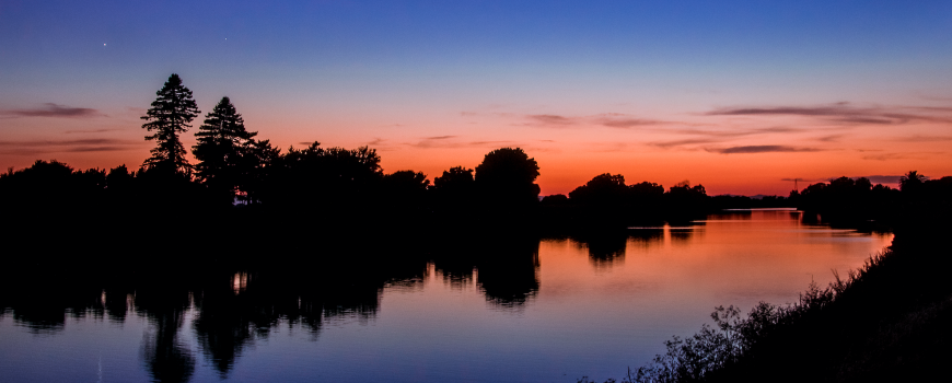 a colorful sunset reflected on the sacramento river