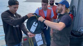 California Sea Grant state fellow Pike Spector orients students to the finer points of tether management aboard the r/v Shearwaters. Photo credit: Dr. Peavey-Reeves