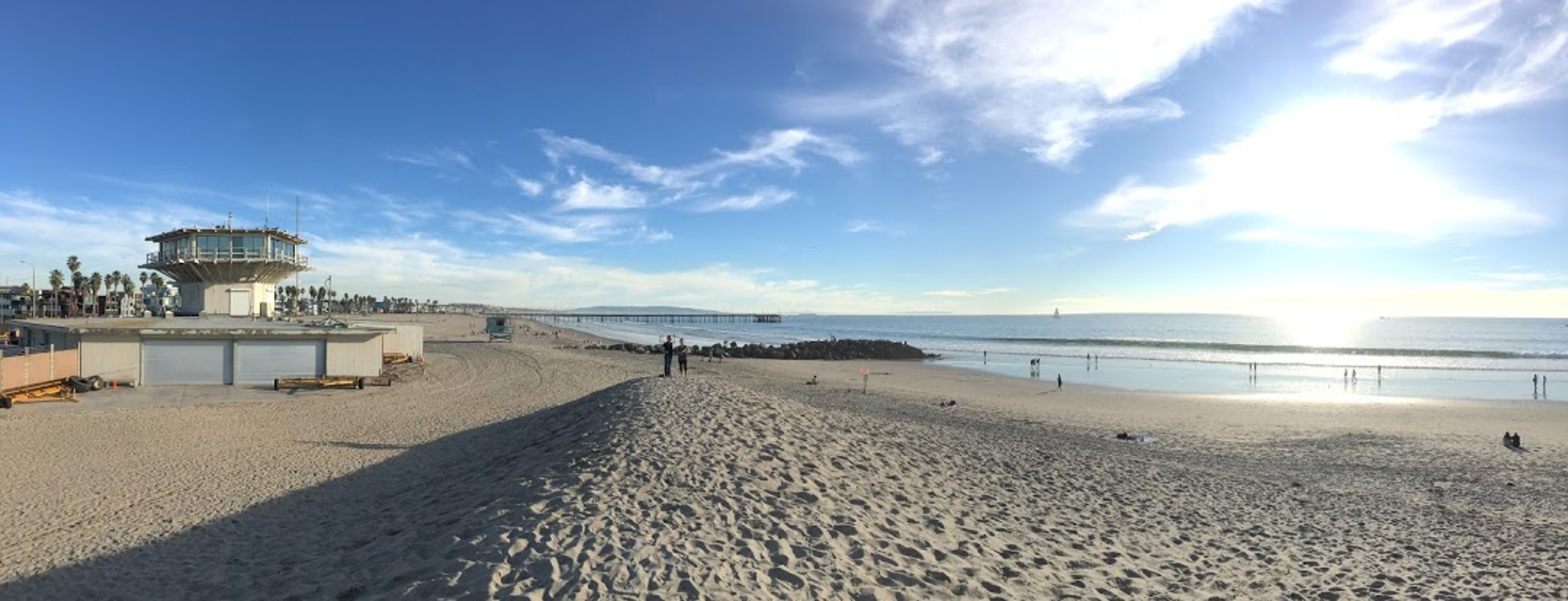 Panorama of sand berm on Venice beach and lifeguard tower