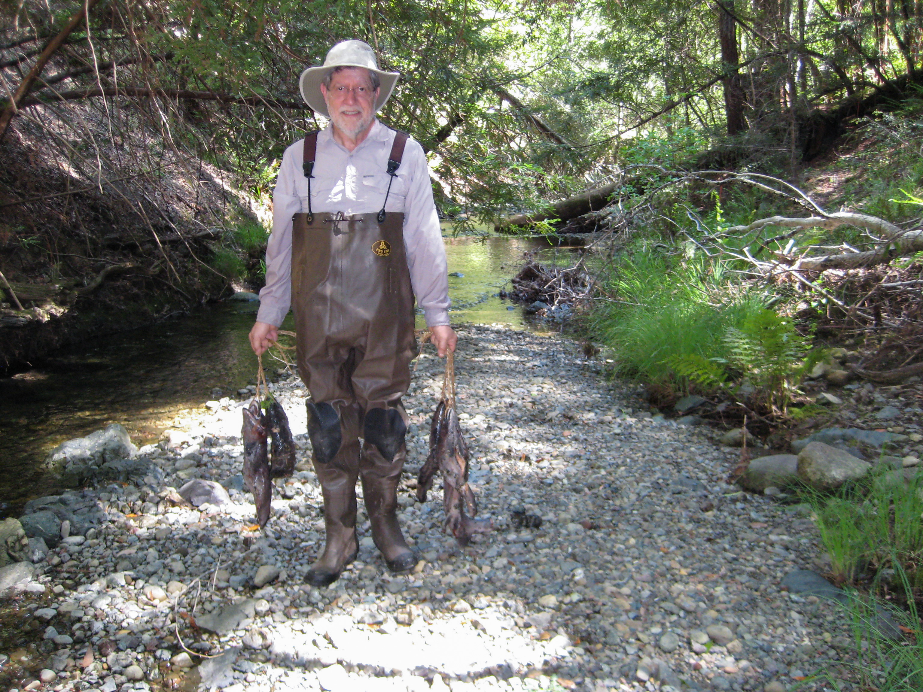 Pete Gruchawka, husband of Nancy Summers, holding salmon carcasses