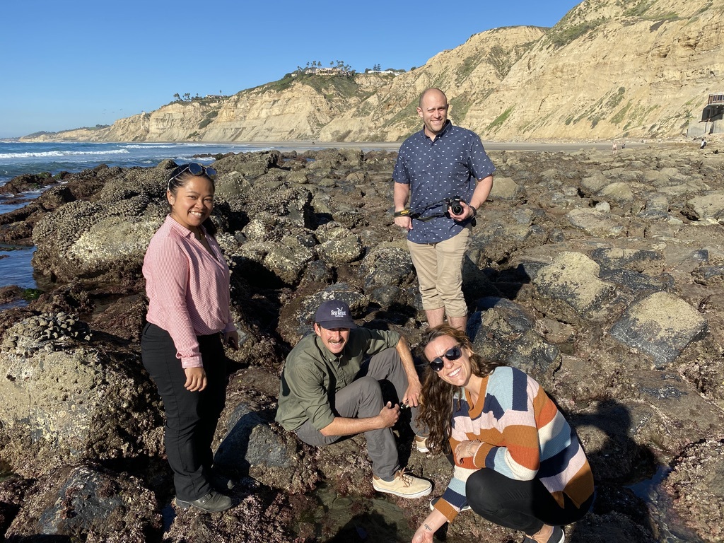 Group of people standing by tide pools
